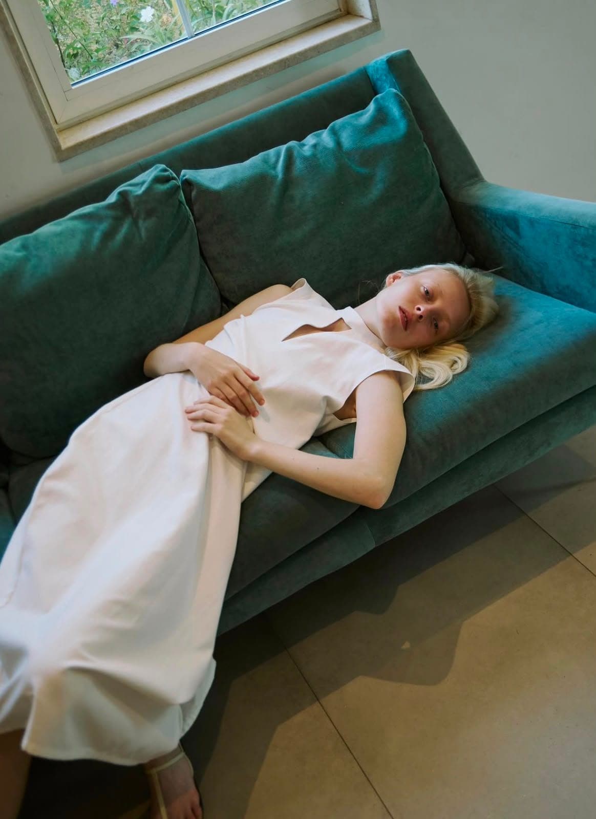 Quiet luxury at rest — natural fabric, softness, intention.