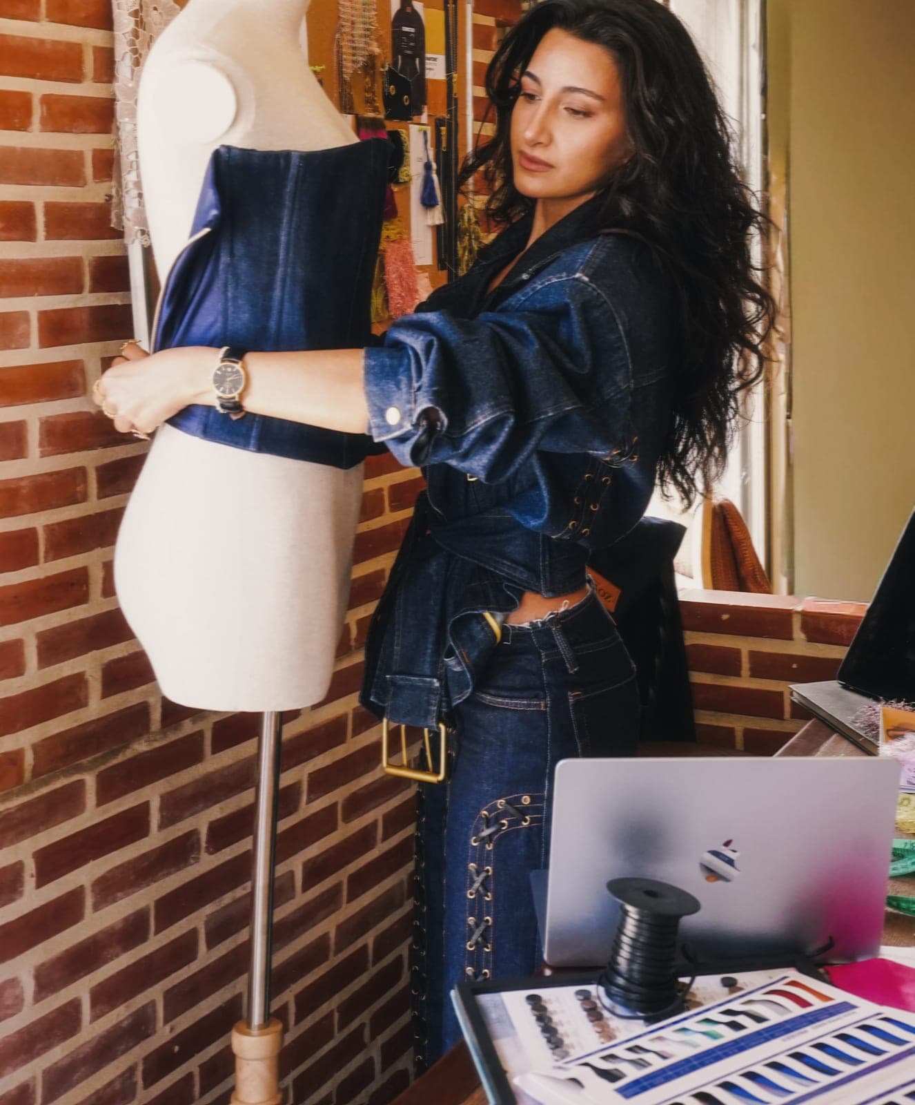 Draping by hand: where every Zoyeh piece begins.
